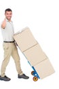 Delivery man with cardboard boxes gesturing thumbs up Royalty Free Stock Photo