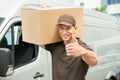 Delivery Man With Cardboard Boxes Showing Thumbs up Sign Royalty Free Stock Photo