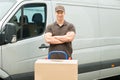 Delivery Man With Cardboard Boxes On Trolley Royalty Free Stock Photo