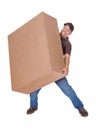 Delivery Man Carrying Heavy Box Royalty Free Stock Photo