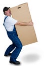 Delivery man carrying heavy cardboard box Royalty Free Stock Photo