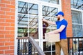 Delivery man delivering boxes Royalty Free Stock Photo