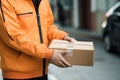 Delivery man delivering holding parcel box Royalty Free Stock Photo