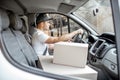 Driver delivering goods by vehicle Royalty Free Stock Photo