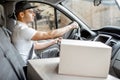 Driver delivering goods by vehicle Royalty Free Stock Photo