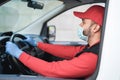 Delivery man driving truck van with parcels to customers - Focus on face Royalty Free Stock Photo