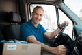 Delivery man driving van Royalty Free Stock Photo