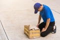 Delivery man he emotional courier hold damaged cardboard box is broken Royalty Free Stock Photo