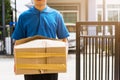 Delivery man he emotional courier hold damaged cardboard box is broken Royalty Free Stock Photo