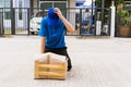 Delivery man he emotional courier hold damaged cardboard box is broken Royalty Free Stock Photo