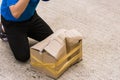 Delivery man he emotional courier hold damaged cardboard box is broken Royalty Free Stock Photo