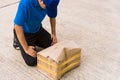 Delivery man he emotional courier hold damaged cardboard box is broken Royalty Free Stock Photo