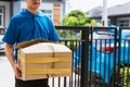 Delivery man he emotional courier hold damaged cardboard box is broken Royalty Free Stock Photo