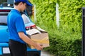 Delivery man he emotional courier hold damaged cardboard box is broken Royalty Free Stock Photo