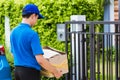 Delivery man he emotional courier hold damaged cardboard box is broken Royalty Free Stock Photo