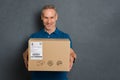 Delivery man giving package Royalty Free Stock Photo