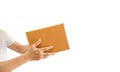 Delivery man hand holding parcel cardboard box isolated on white background. Online shopping and delivery transport Royalty Free Stock Photo