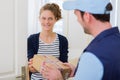 Delivery man handing over a parcel to customer