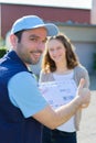 Delivery man handing over a registered letter Royalty Free Stock Photo