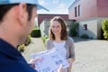 Delivery man handing over a registered letter Royalty Free Stock Photo