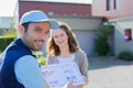 Delivery man handing over a registered letter Royalty Free Stock Photo