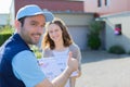 Delivery man handing over a registered letter Royalty Free Stock Photo