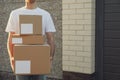 Delivery man hold blank boxes outdoor Royalty Free Stock Photo