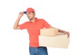 Delivery man holding carton boxes hand on cap in uniform