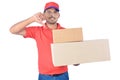 Delivery man holding carton boxes, thumb down in uniform Royalty Free Stock Photo