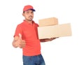 Delivery man holding carton boxes, thumb up in uniform Royalty Free Stock Photo