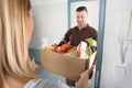 Delivery Man Holding Groceries Royalty Free Stock Photo
