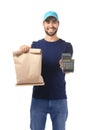 Delivery man holding paper bag with food and payment terminal on white background Royalty Free Stock Photo