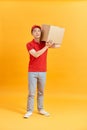 Delivery man holding parcel box isolated on white background Royalty Free Stock Photo