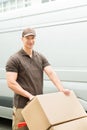 Delivery Man Holding Trolley With Cardboard Boxes Royalty Free Stock Photo