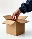 Delivery man opening cardboard box checking contents Royalty Free Stock Photo