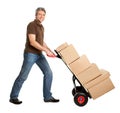 Delivery man pushing hand truck and stack of boxes Royalty Free Stock Photo