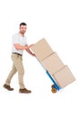 Delivery man pushing trolley of boxes Royalty Free Stock Photo