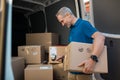 Deliveryman scanning parcel barcode