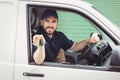 Delivery man sitting in his van Royalty Free Stock Photo
