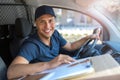 Delivery man sitting in a delivery van Royalty Free Stock Photo