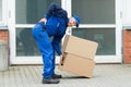 Delivery Man Suffering From Backpain Royalty Free Stock Photo