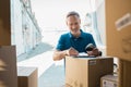 Delivery man updating checklist Royalty Free Stock Photo