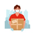 Delivery man wearing medical mask and gloves with box during the prevention of coronovirus. Courier with the package on the city