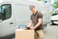 Delivery Man Writing On Clipboard Royalty Free Stock Photo