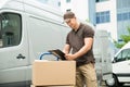 Delivery Man Writing On Clipboard Royalty Free Stock Photo