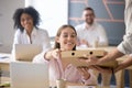 Delivery man giving pizza box to smiling female office worker Royalty Free Stock Photo