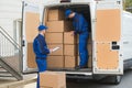 Delivery Men Unloading Boxes