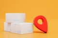 delivery of parcels to the specified address. parcel and red gps dot on a orange background. 3D render Royalty Free Stock Photo