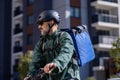 delivery person riding electric bicycle