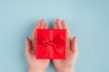 Delivery presents concept. Top above overhead first person close up view photo of female palms holding cute nice gift isolated Royalty Free Stock Photo